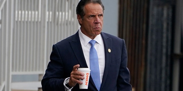 New York Gov. Andrew Cuomo prepares to board a helicopter after announcing his resignation, Tuesday, Aug. 10, 2021, in New York. Cuomo says he will resign over a barrage of sexual harassment allegations. The three-term Democratic governor's decision, which will take effect in two weeks, was announced Tuesday as momentum built in the Legislature to remove him by impeachment. (AP Photo/Seth Wenig)