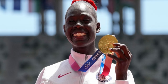Gold medalist Athing Mu, of the United States, stands during the medal ceremony for the women's 800-meter at the 2020 Summer Olympics, Wednesday, Aug. 4, 2021, in Tokyo, Japan. (AP Photo/Francisco Seco)