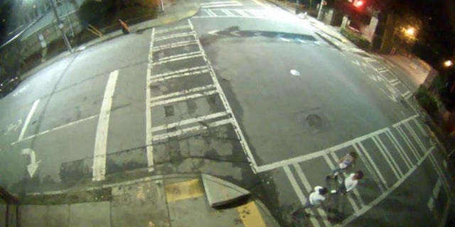 Photos released by police show pedestrians walking near the park around the time of the killing. 