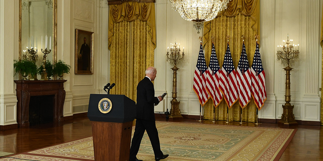 US President Joe Biden departs after delivering remarks about the situation in Afghanistan in the East Room of the White House.