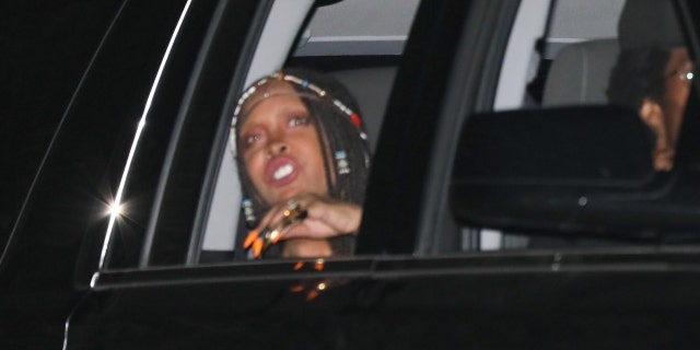 Musician Erykah Badu seemingly spoke to photographers from a car at Barack Obama's 60th birthday party.