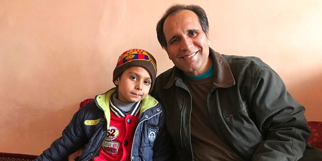 "I just basically fell in love with this little boy," Mujtaba said, "And based on hearing everything, then we knew we had the means and the motivation to help him." (Courtesy of Bahaudin Mujtaba via AP)