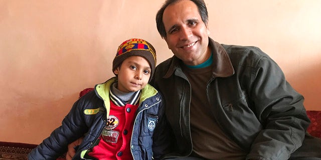 "I just basically fell in love with this little boy," Mujtaba said, "And based on hearing everything, then we knew we had the means and the motivation to help him." (Courtesy of Bahaudin Mujtaba via AP)