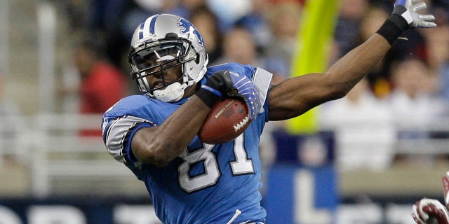 In this Oct. 26, 2008, file photo, Detroit Lions wide receiver Calvin Johnson makes catch against the Washington Redskins in the fourth quarter of an NFL football game in Detroit. Calvin Johnson is simply in awe that he will soon join Jim Brown and Gale Sayers as Pro Football Hall of Famers inducted at the age of 35 years old or younger. (AP Photo/Paul Sancya, File)