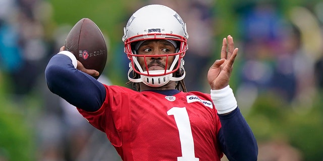 New England Patriots quarterback Cam Newton ends up passing the ball during an NFL football practice, in this file photo from Wednesday, July 28, 2021, in Foxborough, Mass. (AP Photo / Steven Senne, File)