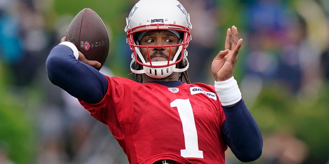 New England Patriots quarterback Cam Newton ends up passing the ball during an NFL football practice, in this file photo from Wednesday, July 28, 2021, in Foxborough, Mass. (AP Photo / Steven Senne, File)