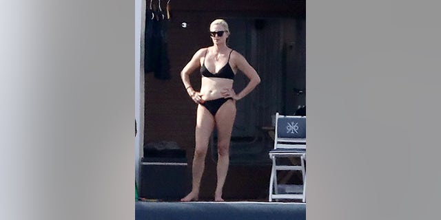 Charlize Theron showed off her figure while boating in Greece.
