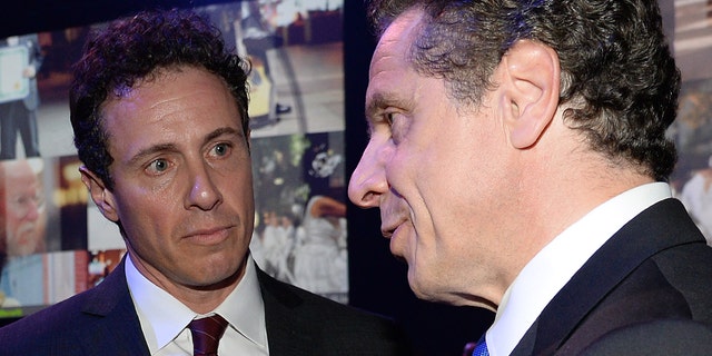 New York Governor Andrew Cuomo and Chris Cuomo attend the 2015 Robin Hood Foundation Benefit at the Jacob Javitz Center on May 12, 2015 in New York City.