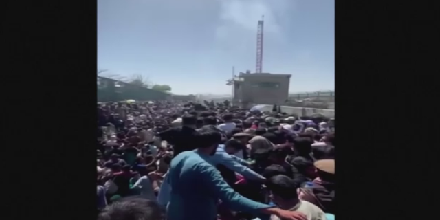 Crowds were seen outside Kabul airport on Thursday before the deadly suicide bombing.