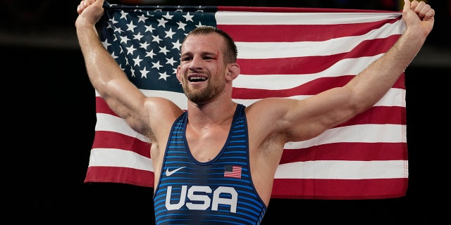United States' David Morris Taylor III celebrates holding the US flag after winning the gold medal in the men's 86kg Freestyle wrestling event at the 2020 Summer Olympics, Thursday, Aug. 5, 2021, in Tokyo, Japan. (AP Photo/Aaron Favila)