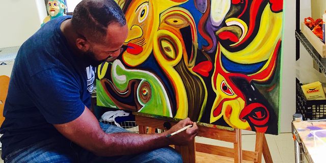 Retired Army Staff Sergeant Alfredo De los Santos working on one of his pieces.