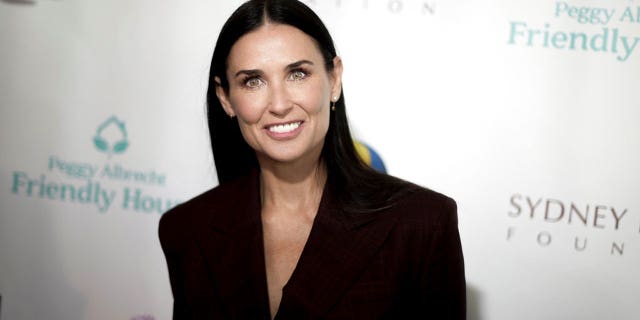 Demi Moore sizzled in a red one-piece Andie's Swim bathing suit. The star has been spending time in the sun this summer and flaunting her bikini body.