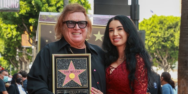 Don McLean and Paris Dylan pose as Musician Don McLean Honored With Star On The Hollywood Walk Of Fame on August 16, 2021 in Hollywood, Calif. 