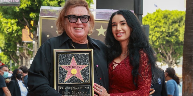 Don McLean and Paris Dylan pose as Musician Don McLean Honored With Star On The Hollywood Walk Of Fame on August 16, 2021 in Hollywood, Calif.