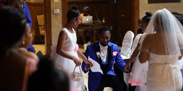 Groom delivers adoption vows to stepdaughters at wedding
