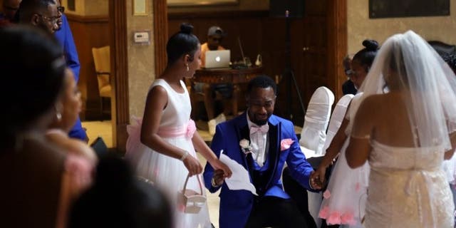 Groom delivers adoption vows to stepdaughters at wedding