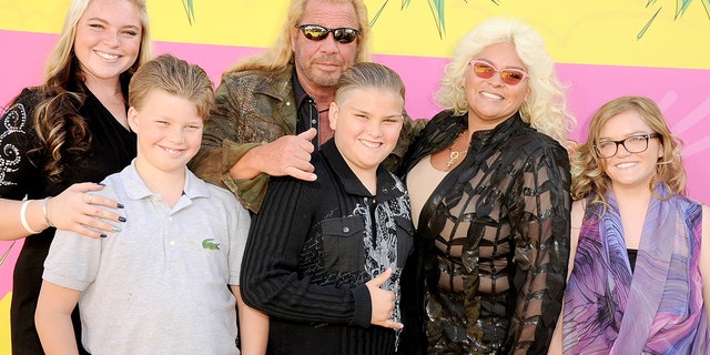 Cicily Chapman, left, and sister Bonnie, right, say their dad, Duane 'Dog' Chapman, center, didn't invite them to his wedding to his new wife. Their mother, Beth Chapman, second from right, died of throat cancer in 2019.