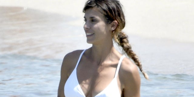 The star wore a pristine white bikini for her outing.