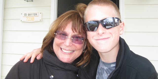 Judy Rogg and her late son Erik Robinson, 12, are pictured in March 2010.