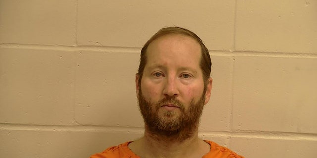 Eric Reinbold is on trial on charges of murder for the murder of his wife, authorities say.  (Pennington County, Minn., Sheriff's Office)