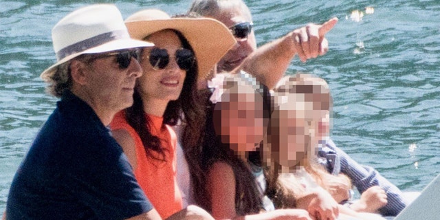 George Clooney and his wife Amal Clooney were all smiles during a boat trip with their twins, Ella and Alexander in Lake Como, Italy on Wednesday.