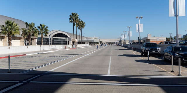 An empty crosswalk and drop-off for departing flights greets travelers at John Wayne Airport in Santa Ana, California, Jan. 26, 2021. (Getty Images)