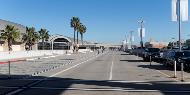 An empty crosswalk and drop-off for departing flights greets travelers at John Wayne Airport in Santa Ana, California, Jan. 26, 2021. (Getty Images)