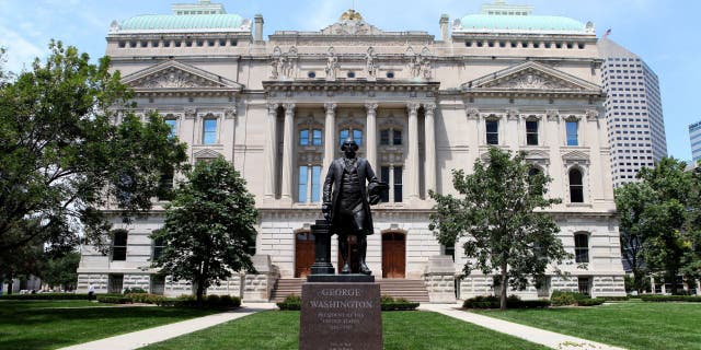 A George Washington statue stands outside the Indiana State Capitol Building on July 16, 2015, in Indianapolis, Indiana.