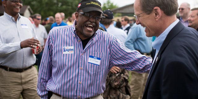 Former Candidate for U.S. Senate Rep. Jack Kingston, R-Ga., right, speaks with Georgia State Representative Al Williams at the Law Enforcement Cookout at Wayne Dasher's pond house in Glennville, Ga., on Thursday, April 17, 2014. (Photo By Bill Clark/CQ Roll Call)