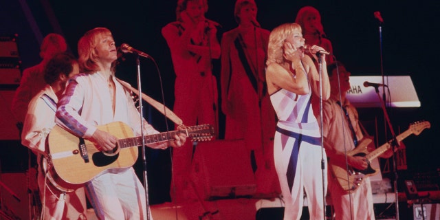 Singers Agnetha Fältskog (right) and Björn Ulvaeus performing with Swedish pop group Abba on their third, and final, tour, 1979. 