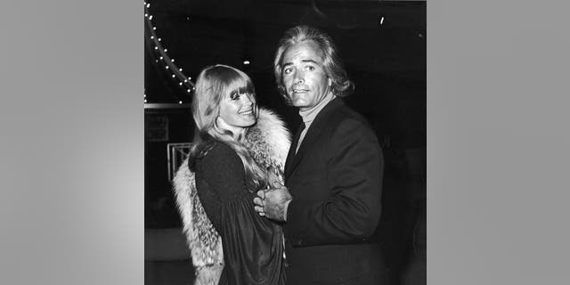 American actor John Derek (1926 - 1998) and his third wife, American actress Linda Evans, attend a Sonny and Cher opening at Century Plaza Hotel, Los Angeles, California, circa 1972. Derek and Evans were married from 1968-74.