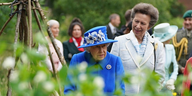 Queen Elizabeth II and Princess Anne, Princess Royal, visit the Children's Wood Project,  a community project in Glasgow as part of her traditional trip to Scotland for Holyrood Week on June 30, 2021, in Glasgow, Scotland. The visit marked the 95-year-old's first official visit north of the border since the death of her husband, the Duke of Edinburgh. 