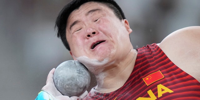 Lijiao Gong, of China, competes in the qualification rounds of the women's shot put at the 2020 Summer Olympics, Friday, July 30, 2021, in Tokyo. (AP Photo/Matthias Schrader)