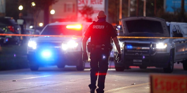 A deputy in Harris County, Texas, at a crime scene. Hundreds are expected to gather in Houston Sunday to honor those murdered over the past year for a day of remembrance. 