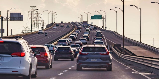 Vehicles head slowly east on the Interstate-10 twin spans leaving New Orleans while only a trickle of cars heads west back into the city before landfall of Hurricane Ida in New Orleans, Saturday, Aug. 28, 2021. (Associated Press)
