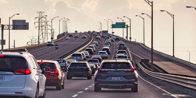 Vehicles head slowly east on the Interstate-10 twin spans leaving New Orleans while only a trickle of cars heads west back into the city before landfall of Hurricane Ida in New Orleans, Saturday, Aug. 28, 2021. (Associated Press)