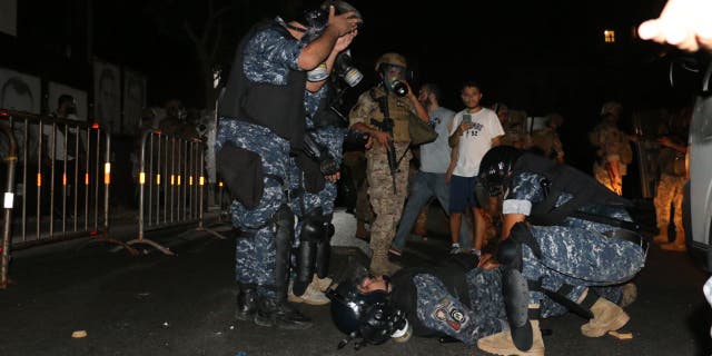 A security guard injured during protests on the anniversary of a massive explosion in Beirut.