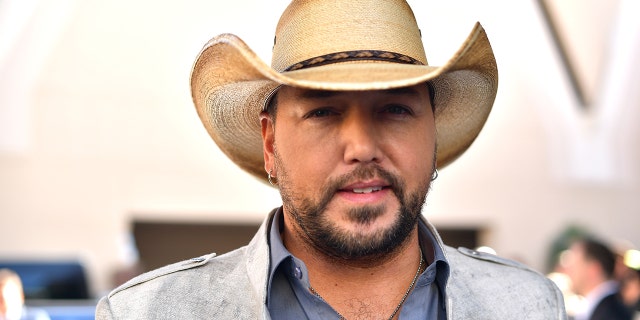 Jason Aldean was performing onstage in Las Vegas in 2017 when a gunman opened fire and killed more than 50 concertgoers and people in the area. (Getty Images)