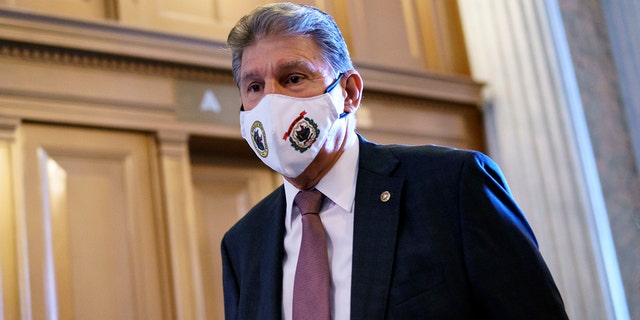 Sen. Joe Manchin, D-W.Va., a key moderate in the infrastructure agreement, arrives at the Senate in Washington, Tuesday, Aug. 10, 2021. (AP Photo/J. Scott Applewhite)