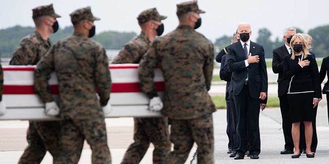 President Biden attends the dignified transfer of the remains of a fallen service member at Dover Air Force Base in Delaware, August, 29, 2021, one of the 13 members of the US military killed in Afghanistan. 