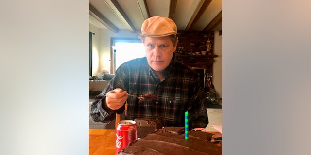 In this photo provided by Vedanta Griffith, Joshua Spriestersbach enjoys birthday cake on April 12, 2020, in Danby, Vt.