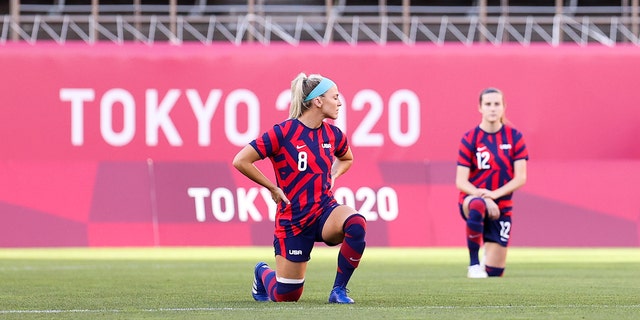 Julie Ertz # 8 of the United States team kneels on the field during the Olympic bronze medal soccer match between the United States and Australia at Kashima Stadium on August 5, 2021 in Kashima, Ibaraki, Japan.  (Photo by Zhizhao Wu / Getty Images)