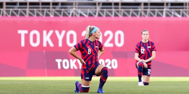 Julie Ertz # 8 of the United States team kneels on the field during the Olympic bronze medal soccer match between the United States and Australia at Kashima Stadium on August 5, 2021 in Kashima, Ibaraki, Japan.  (Photo by Zhizhao Wu / Getty Images)