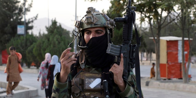 Taliban fighter stand guard at a checkpoint near the gate of Hamid Karzai international Airport in Kabul, Afghanistan, Saturday, Aug. 28, 2021. Â (AP Photo/Wali Sabawoon)