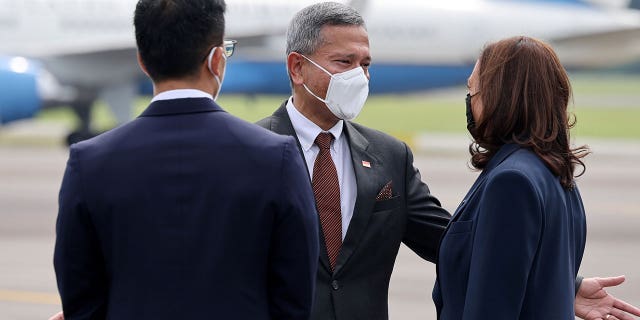 Vivian Balakrishnan, Singapore's foreign affairs minister, greets U.S. Vice President Kamala Harris upon her arrival in Singapore, Aug. 22, 2021. (Reuters)