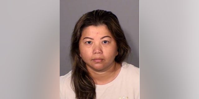 Karina See Her, 40, is charged with killing her ex-husband, whose body was discovered inthe backyard of their home, authorities said.