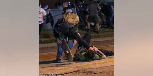 The lawsuit includes a photo of Anthony Huber seen with a skateboard during a confrontation with Kyle Rittenhouse on Aug. 25, 2020. 