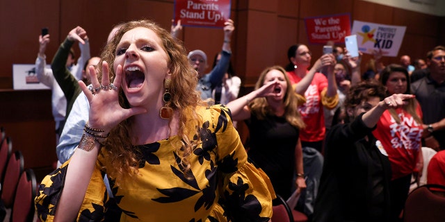 Angry parents and community members protesting after a Loudoun County School Board meeting was halted by the school board because the crowd refused to quiet down, in Ashburn, Va., June 22.