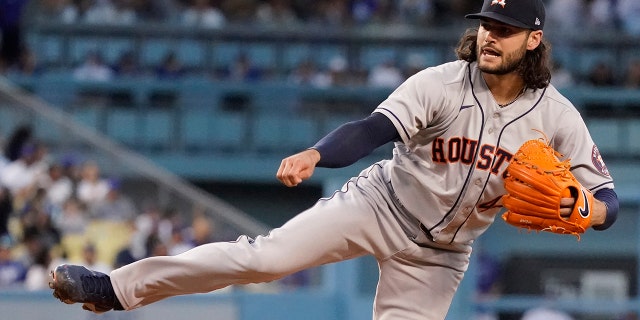 Houston Astros starting pitcher Lance McCullers Jr. watches a delivery to a Los Angeles Dodgers batter during the second inning of a baseball game Tuesday, Aug. 3, 2021, in Los Angeles. (AP Photo/Marcio Jose Sanchez)