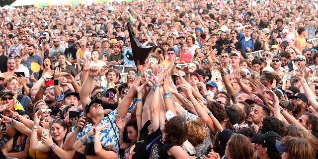 CHICAGO, ILLINOIS - JULY 31: Crowd catches Wes Borland's guitar during Lollapalooza 2021 at Grant Park on July 31, 2021 in Chicago, Illinois. (Photo by Kevin Mazur/Getty Images)
